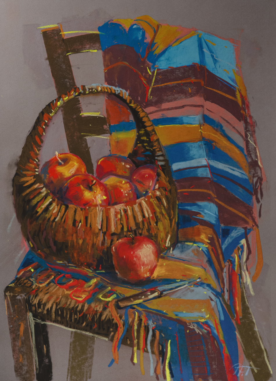 Basket of apples on a chair